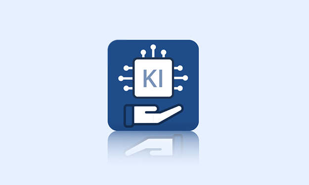 **Description concise et accessible de l'image:** Une icône bleue montre une micropuce avec l'inscription « IA », entourée de lignes de connexion. En dessous, une main stylisée tient la puce – symbole de l'intelligence artificielle d'assistance.